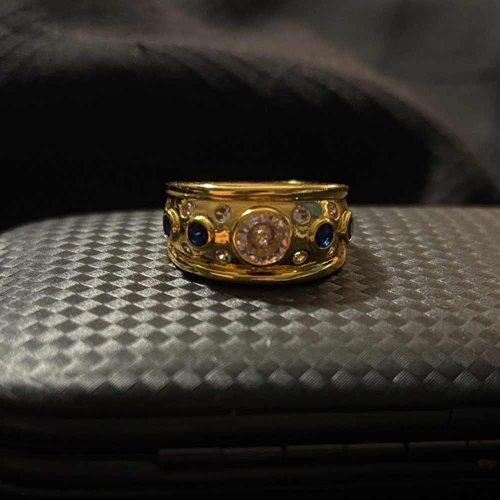 Gold cigar band style ring with Blue and Crystal Stones